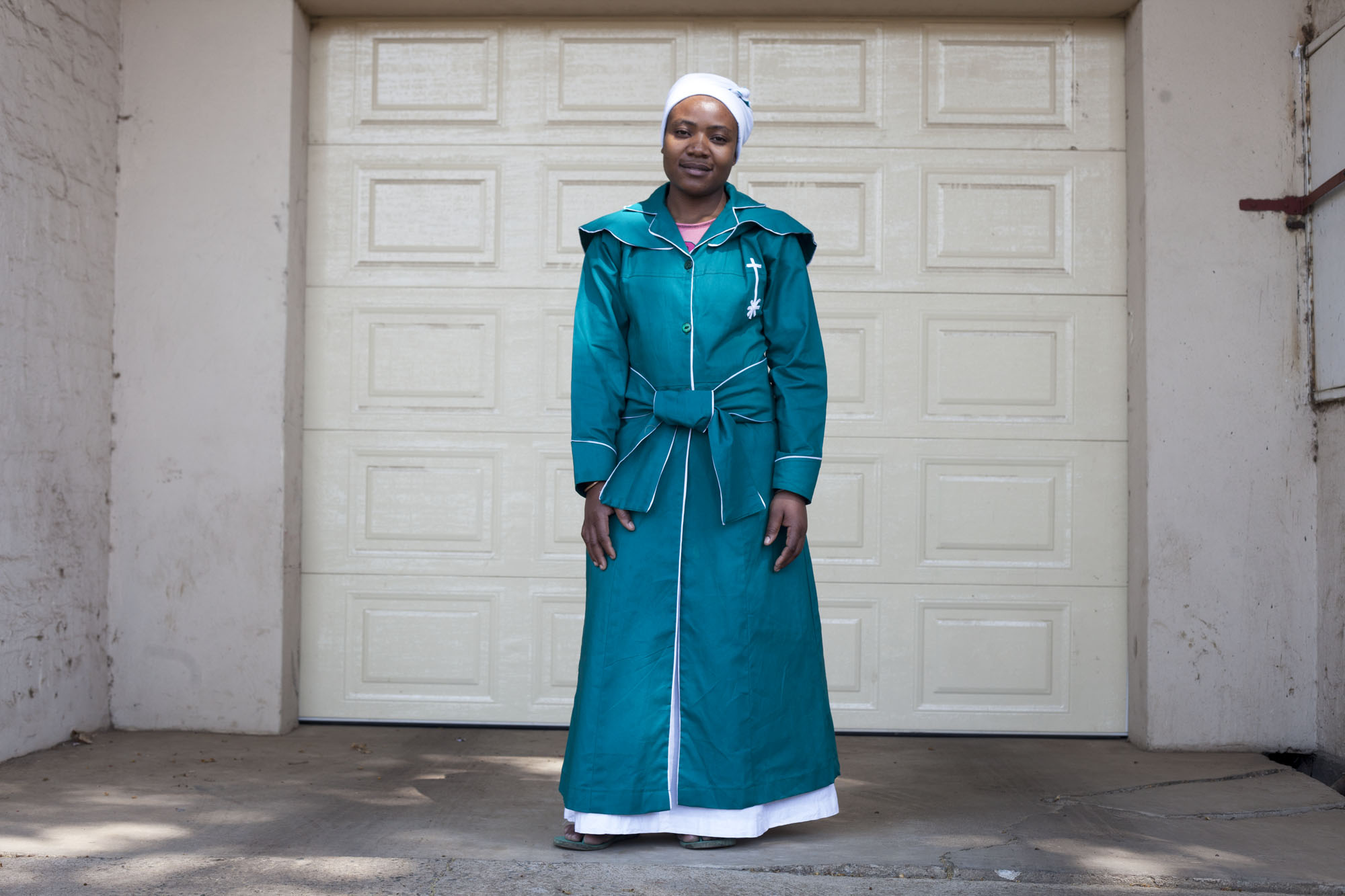 SUNDAY BEST
For many immigrants who come to Johannesburg they battle to adapt to the challenges of a new life in a big city. Their cultural ways become a thing of memory than one to be lived. Many struggle to adapt to the ways of the big city. However one thing that is common to many immigrants is the specialness associated with Sundays. In many African communities Sunday is a special day, one of worship and relaxation. More to this is that it’s the day to look smart. It’s the day to wear your ‘Sunday best’ as it’s called. It’s the day to wear that jewellery that is special, or the suit, dress that arouses attention. Its perceived as family day, one to sit back and relax.
The approach to the project is street photography on selected streets of Yeoville. Yeoville is inhabited by a large number of African immigrants. The participants will be photographed on Sundays when going or coming from their places of worship or just those who may fit within the theme of ‘Sunday best.’
Yeovile Landscape
Yeoville is said to have been one of the best residential suburbs before 1994. The area was declared a suburb in 1890 and was advertised as a sanitarian for the rich. Set on a ridge, it was said its air was purer unlike the smoky mining city of Johannesburg below, which was fast developing at the time. Over the years, Yeoville has gone through a transformation from a mainly Jewish area to a bohemian cultural centre that attracted all kinds of burgeoning artists and activists. The main streets such as Rocky were transformed from a quiet area that catered for local residents to a host of restaurants, bars, art clubs that attracted visitors from afar.
By 1990’s most of the white residents were moving to seemingly better suburbs due to great infrastructure decay and chaos including drugs and other crimes that visited Yeoville. Their place was taken mainly by hundreds of African immigrants and the area is generally perceived to be a Pan Africanist suburb. Although sti
