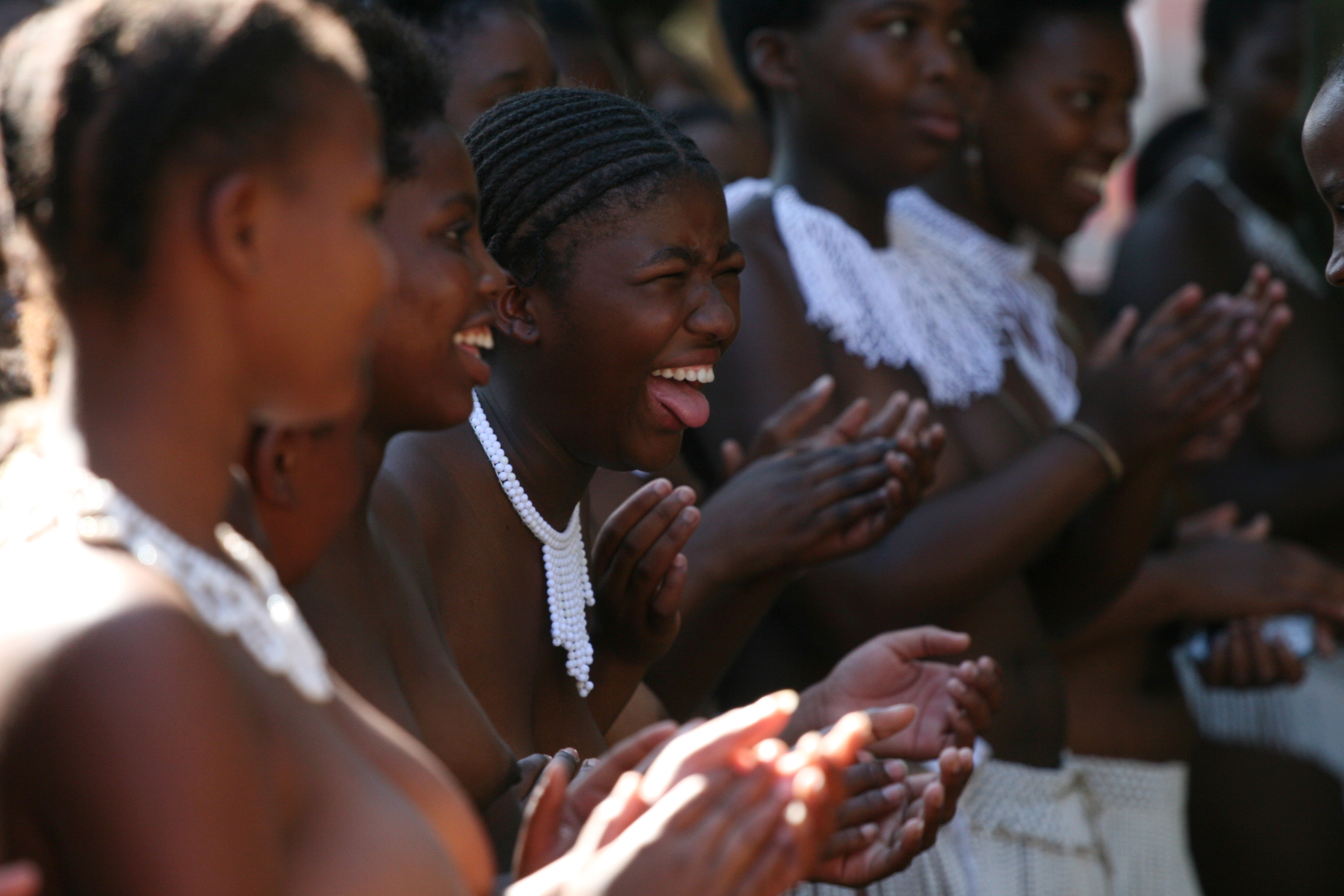 Teenage girls traditional songs after undergoing a virginity test on sunday 18 February in Pietmaritzburtg town about 480 kilometers from Johnnesburg.There were 200 girls aged between 6 and 31 years who underwent the process and declared as virgins.Although human rights activists have been condemming this Zulu culture as demeaning and incorrect the women elders who carry it out have vowed that it must continue.They argue that it prevents the spread of HIV and also gives self esteem to those who are declared as virgins.Photo Antony Kaminju